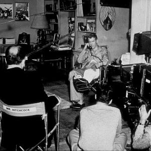 Rear Window James Stewart on the set while Alfred Hitchcock directs 1954 Paramount