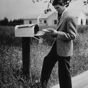 James Stewart standing next to a mailbox, 1936. Vintage silver gelatin, 13x10, estate stamped. $1200 © 1978 Ted Allan MPTV