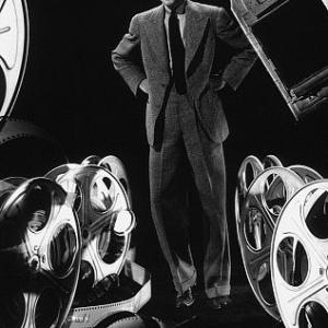 James Stewart standing between large film reels 1936 Modern silver gelatin 14x11 estate stamped 600 Modern silver gelatin 20x16 estate stamped 800  1978 Ted Allan MPTV