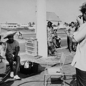 Elizabeth Taylor and a friend get photographed by Richard Burton