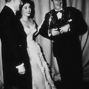 Elizabeth Taylor, second husband Michael Wilding and Walt Disney at the Academy Awards