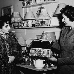 Elizabeth Taylor on a day off from Conspirator visits a London gift shop
