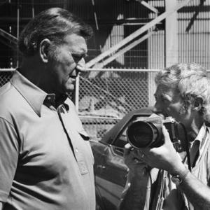 John Wayne and photographer David Sutton on the set of McQ