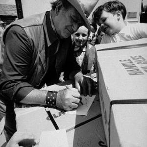 Signing autographs on location for The Cowboys Warner Bros 1971