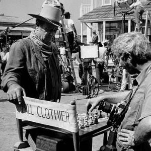 John Wayne and photographer David Sutton playing chess on the set of Chisum Warner Bros 1969
