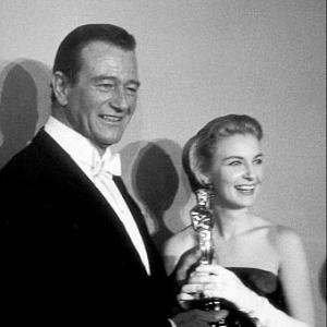 Academy Awards 30th Annual John Wayne and Joanne Woodward