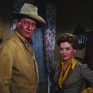 Still of John Wayne and Angie Dickinson in Rio Bravo 1959