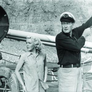Still of John Wayne and Lana Turner in The Sea Chase 1955
