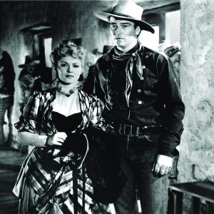 Still of John Wayne and Claire Trevor in Stagecoach 1939