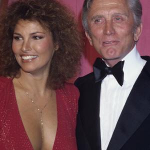 Raquel Welch and Kirk Douglas at The 50th Annual Academy Awards