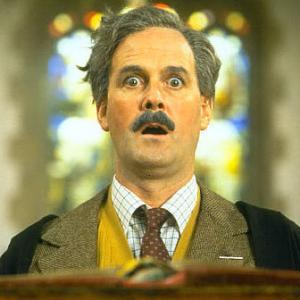 Still of John Cleese in The Meaning of Life (1983)