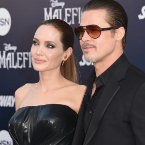 Brad Pitt and Angelina Jolie at event of Piktadares istorija 2014