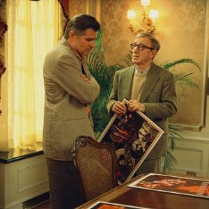 Studio head Hal Yeager (TREAT WILLIAMS) shows director Val Waxman (WOODY ALLEN) some poster ideas for his latest picture in Woody Allen's contemporary comedy HOLLYWOOD ENDING, being distributed domestically by DreamWorks.