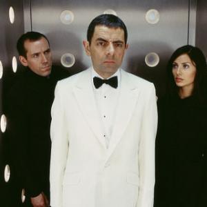 Still of Rowan Atkinson, Natalie Imbruglia and Ben Miller in Johnny English (2003)