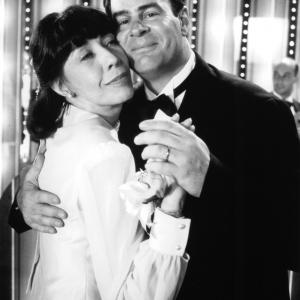 Still of Dan Aykroyd and Lily Tomlin in Getting Away with Murder (1996)