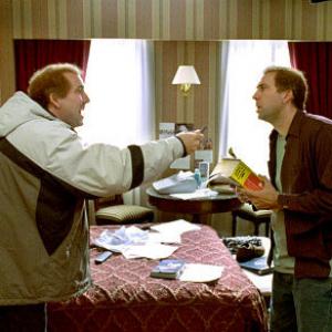 Twinbrothers Donald left and Charlie Kaufman both played by Nicolas Cage travel across the country in their attempt to unlock the mysteries of The Orchid Thief
