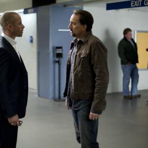 Still of Nicolas Cage and Guy Pearce in Seeking Justice 2011