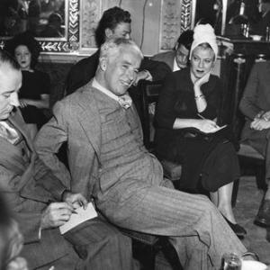 Charlie Chaplin at a press conference for the premiere of 