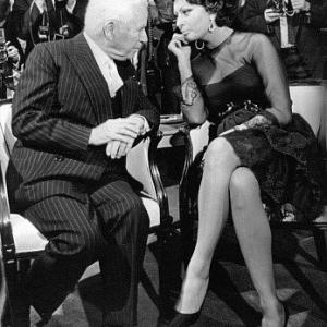 Sophia Loren with Comedian Charlie Chaplin during a press conference, 1965.