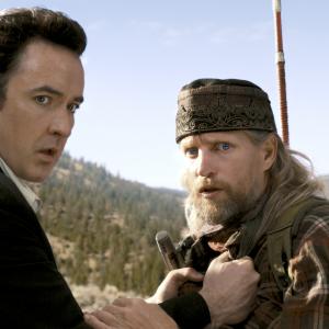 Still of John Cusack and Woody Harrelson in 2012 2009