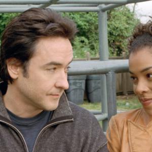 Still of John Cusack and Sophie Okonedo in Martian Child (2007)