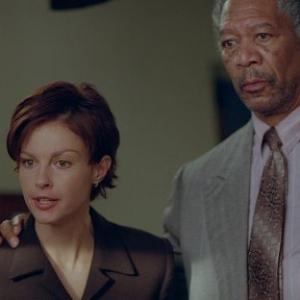 Claire ASHLEY JUDD and Grimes MORGAN FREEMAN react to a surprising development during the trial of her husband