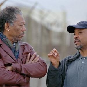 MORGAN FREEMAN (left) and director CARL FRANKLIN discuss a scene on the set of HIGH CRIMES.