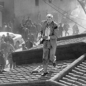 Jack Richard Gere attempts to escape along rooftops in Beijing