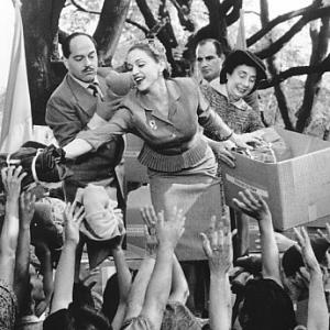 Adored by the people of Argentina Eva Peron Madonna center uses her position as First Lady to help the masses