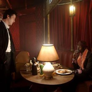 Still of Keanu Reeves and Djimon Hounsou in Constantine (2005)