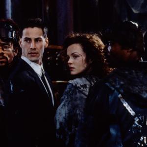 Still of Keanu Reeves and Dina Meyer in Johnny Mnemonic 1995