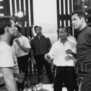 Still of Christian Slater John Travolta and John Woo in Broken Arrow 1996