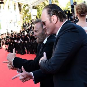 US director Quentin Tarantino C and Italian actor Franco Nero gesture as they arrive with US actress Uma Thurman for the Closing Ceremony of the 67th edition of the Cannes Film Festival in Cannes southern France on May 24 2014