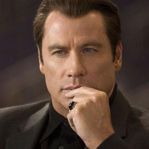 JOHN TRAVOLTA stars as Chili Palmer in MGM Pictures comedy BE COOL