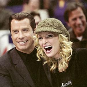 JOHN TRAVOLTA and UMA THURMAN star as Chili Palmer and Edie Athens in MGM Pictures comedy BE COOL
