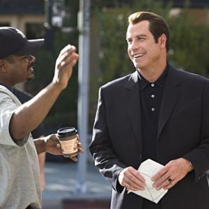 Director F GARY GRAY and JOHN TRAVOLTA on the set of MGM Pictures comedy BE COOL