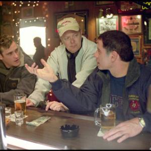 Director Jay Russell (center) discusses a scene with Joaquin Phoenix (left) and John Travolta (right).