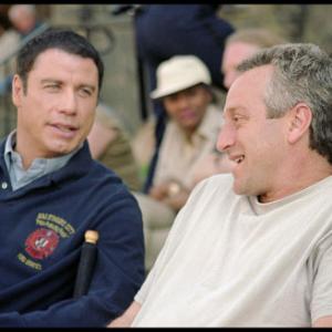 John Travolta left converses with producer Casey Silver right between takes on location in Baltimore