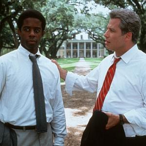 Still of John Travolta and Adrian Lester in Primary Colors (1998)