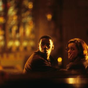 Still of Denzel Washington and Embeth Davidtz in Fallen 1998