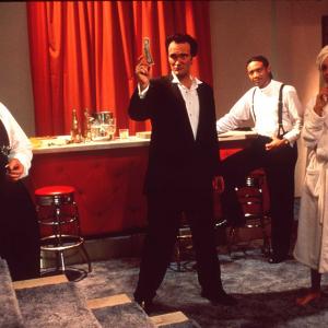 Still of Quentin Tarantino, Bruce Willis, Jennifer Beals and Paul Calderon in Four Rooms (1995)