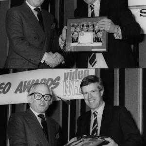 Richard Lord Attenborough graciously presents producer/director Christopher Toyne with two top 1982 International Video Week Philips Awards .