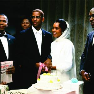 Still of Denzel Washington and Angela Bassett in Malcolm X 1992