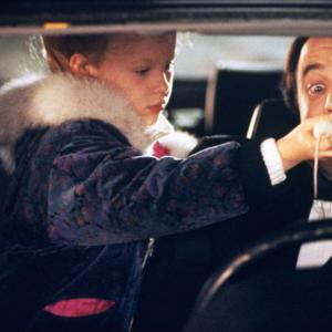 Still of Thora Birch and Kevin Nealon in All I Want for Christmas 1991