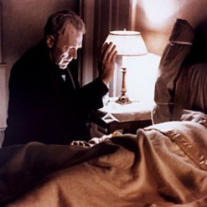 Father Merrin prays at Regan's bedside