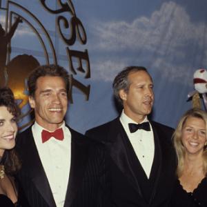 Arnold Schwarzenegger and Maria Shriver with Chevy Chase and his wife Jayni at a Carousel of Hope Ball