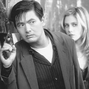 Still of Mira Sorvino and YunFat Chow in The Replacement Killers 1998