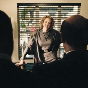 Savvy Hollywood agent Fanny Nash Joan Cusack center instructs members of the FBI on the dos and donts of striking a deal in Hollywood