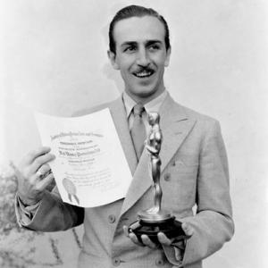 Walt Disney poses with his first oscar, mid 30's, I.V.