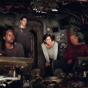 Still of Keanu Reeves, Laurence Fishburne, Carrie-Anne Moss and Harold Perrineau in Matrica: Perkrauta (2003)